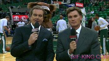 Jazz Bear Walks Behind Reporters