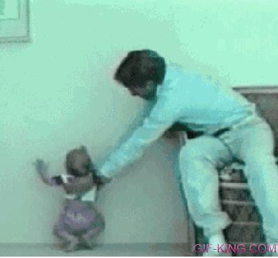 baby climbs wall