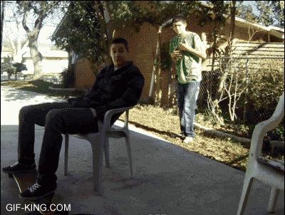 guy kicking chair