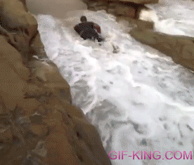 Man Gets Hit by a Wave